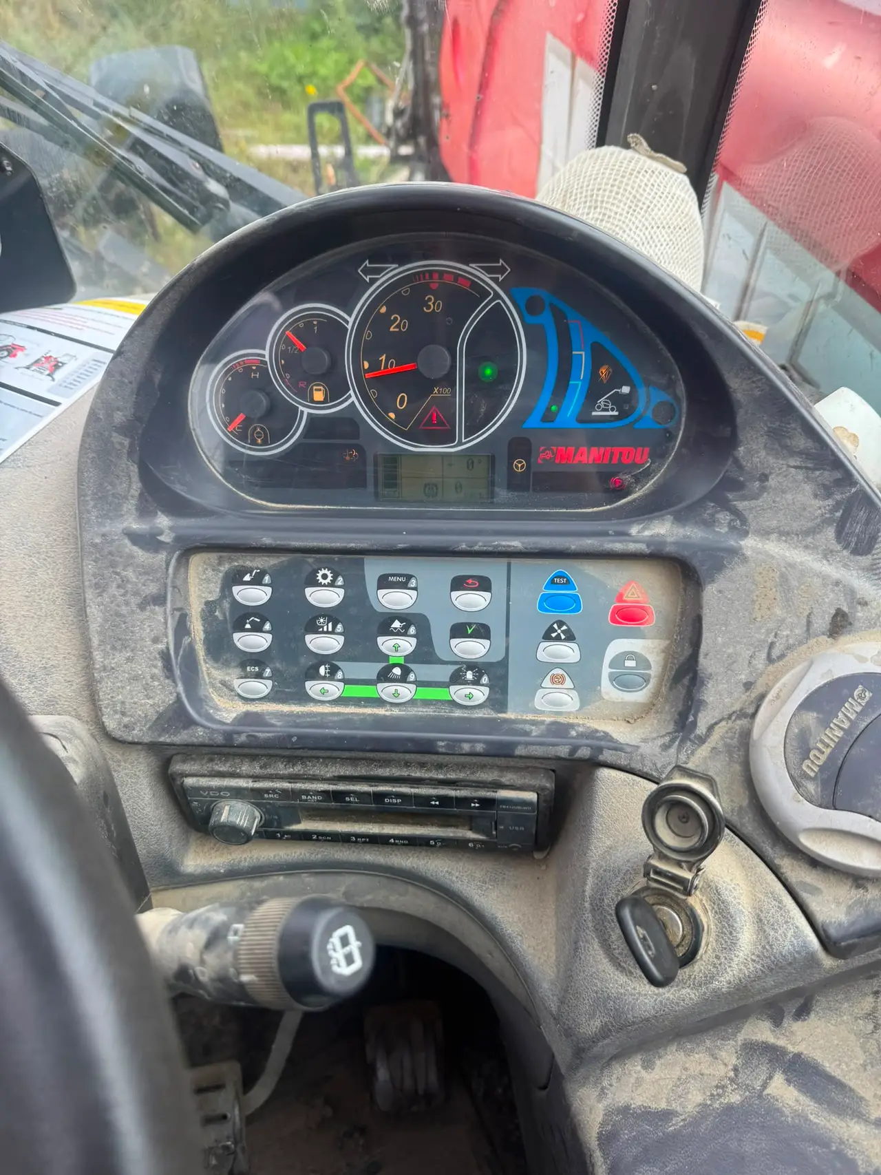 Manitou agricultural machine controls during a field service visit